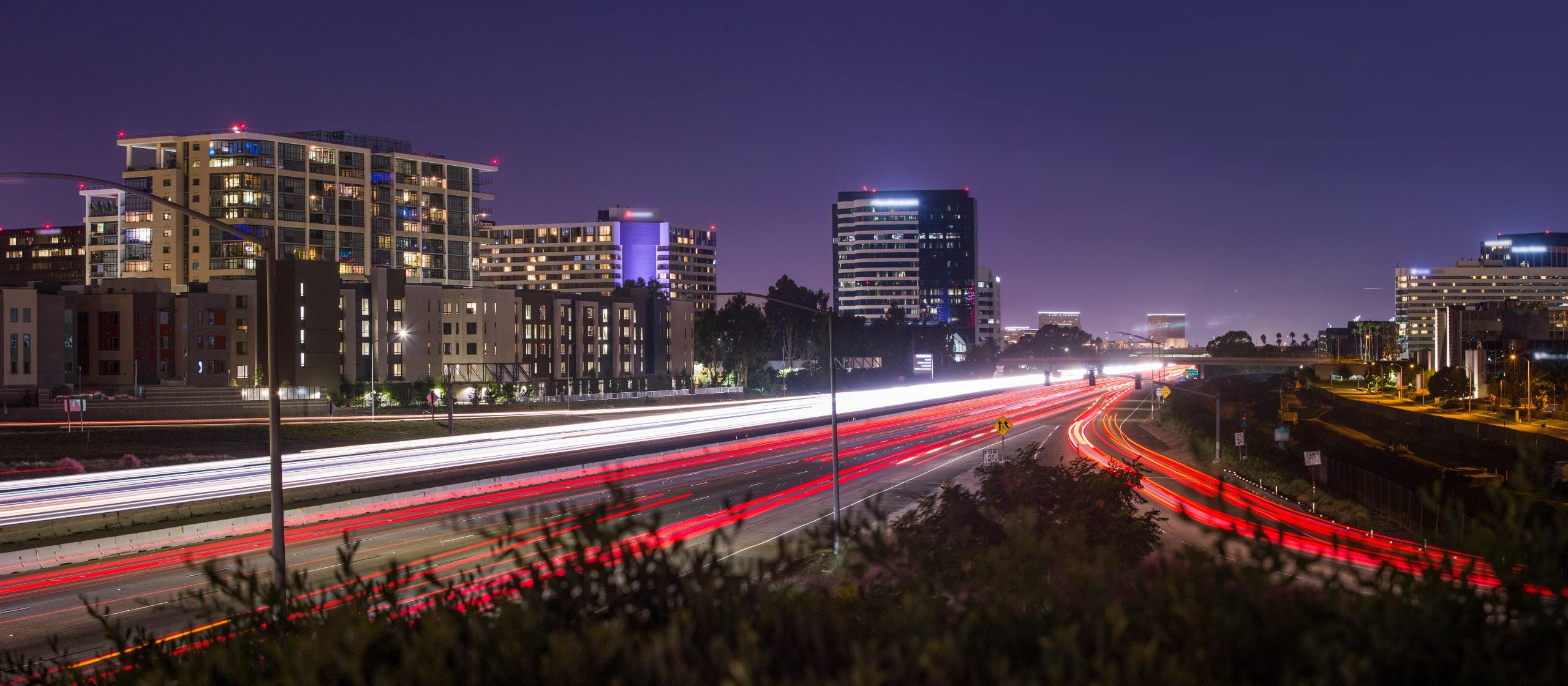 Night view of highway around Lennox at Central Park West, Irvine