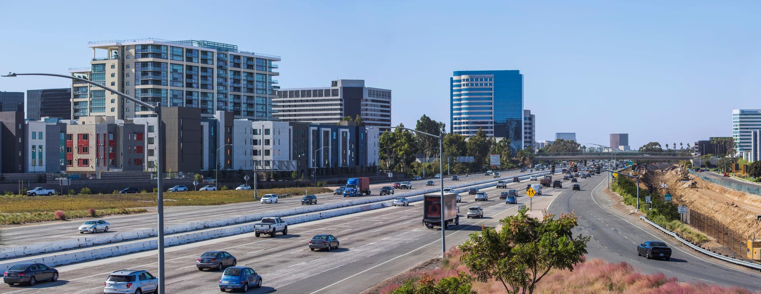 Sunny view of condos and highway around Maxfield at Central Park West, Irvine