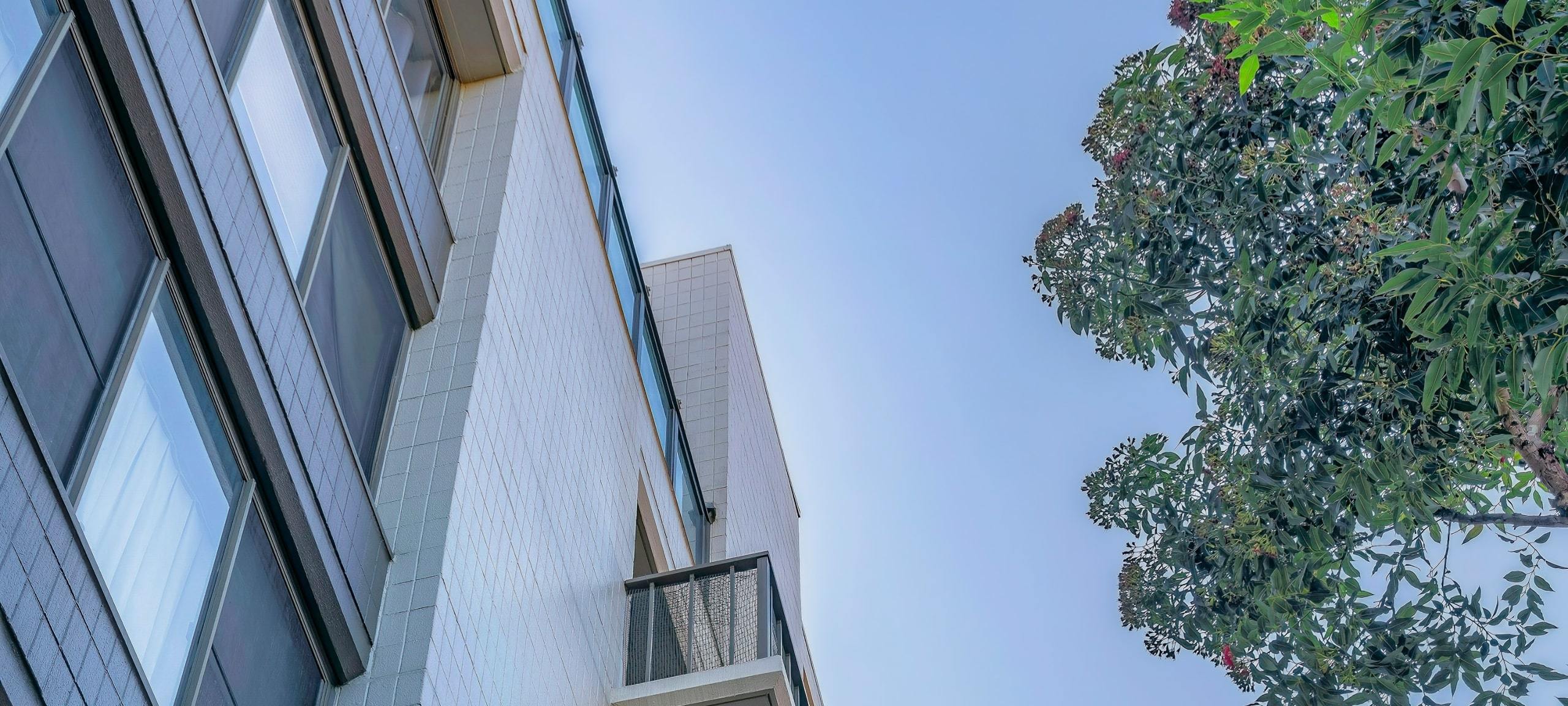 Modern condo building against blue sky in California