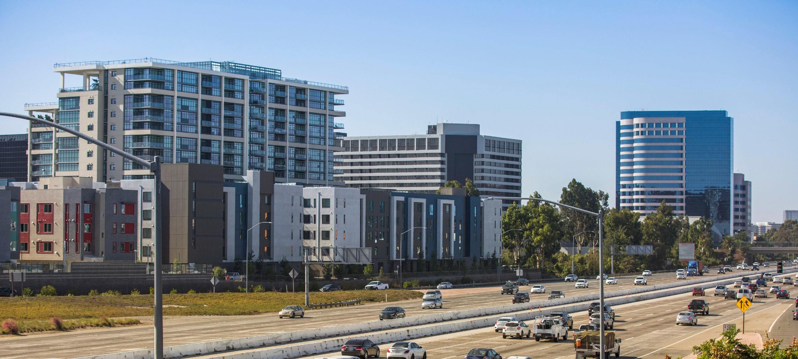 Sunny view of condos and highway around Astoria at Central Park West, Irvine