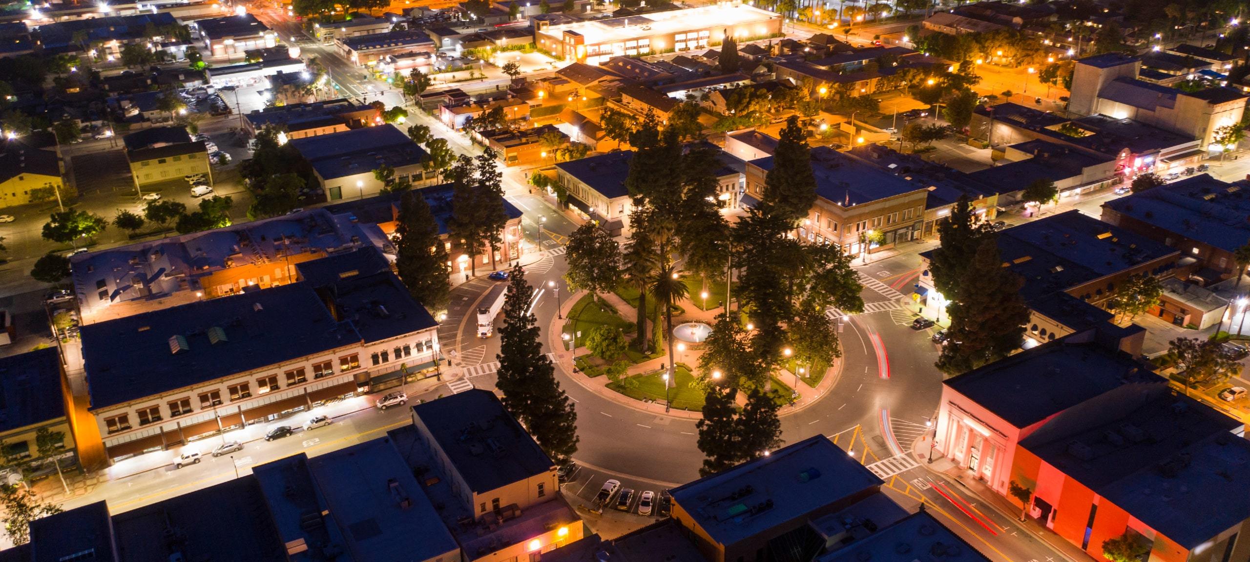 Aerial night view of Plaza Square and buildings in Orange, CA