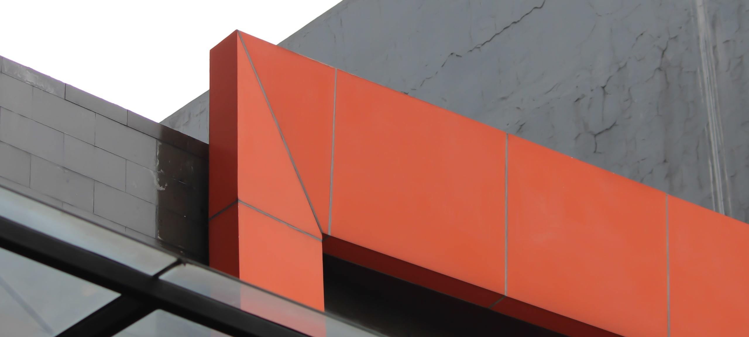 Abstract architecture, gray and orange, on a modern building